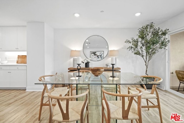 dining space featuring light wood-type flooring