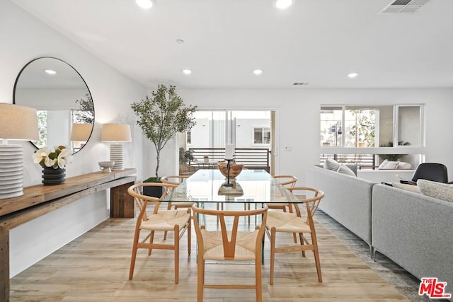 dining area with light hardwood / wood-style flooring