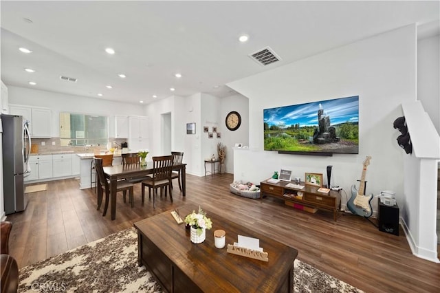 living room with dark wood-type flooring