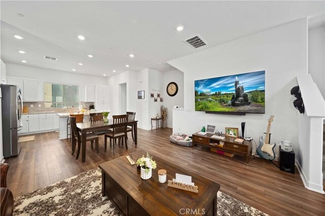 27014 Hummingbird Ln, Valencia, CA 91381 - living area with visible vents, wood finished floors, and recessed lighting