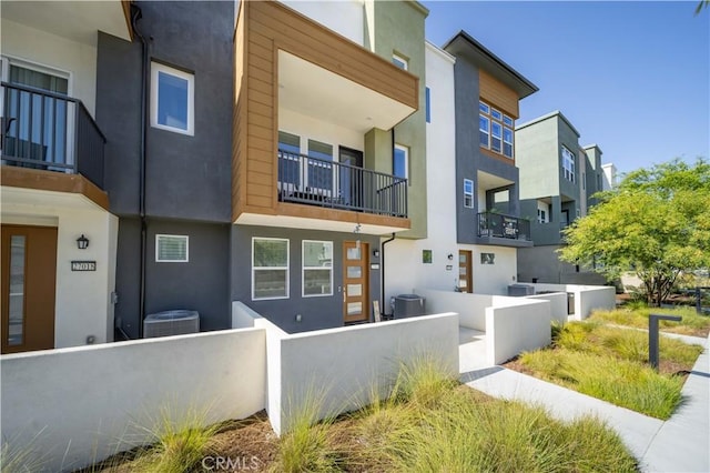 27014 Hummingbird Ln, Valencia, CA 91381 - view of building exterior with central air condition unit, a residential view, and a fenced front yard