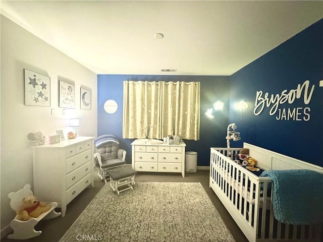 27014 Hummingbird Ln, Valencia, CA 91381 - bedroom with wainscoting, visible vents, and a crib