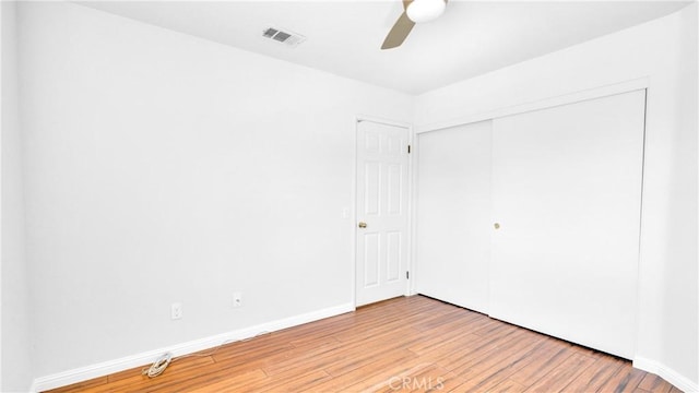 spare room with ceiling fan and light hardwood / wood-style flooring