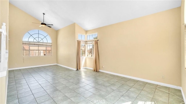 tiled spare room featuring ceiling fan and high vaulted ceiling