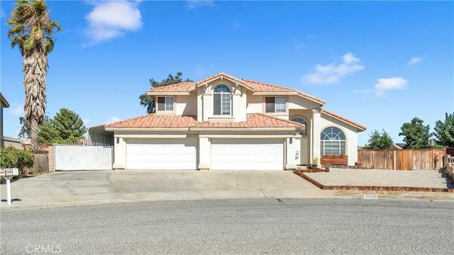 mediterranean / spanish-style house with a garage