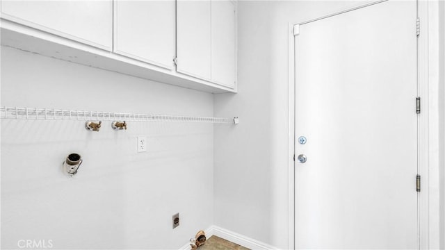 washroom with cabinets and hookup for an electric dryer