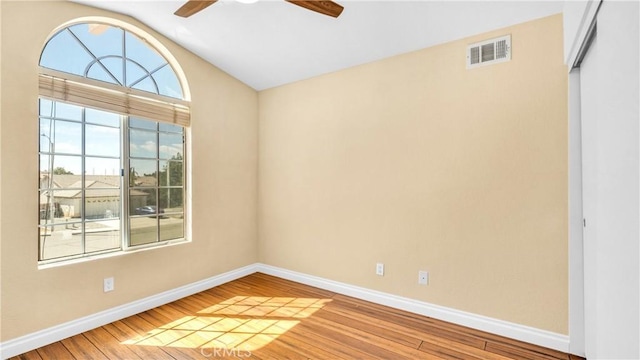 spare room with wood-type flooring and ceiling fan