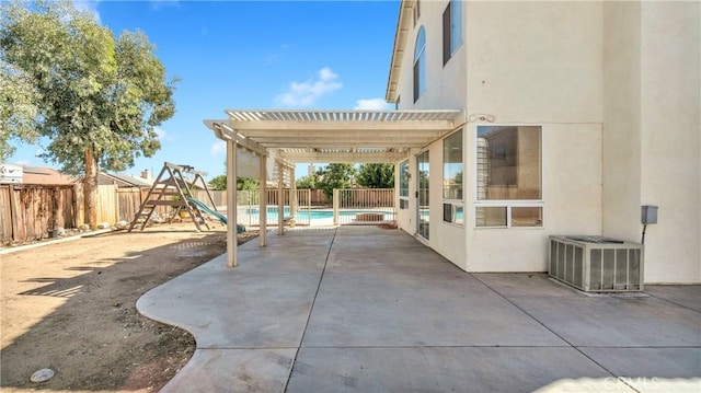 view of patio with a playground, cooling unit, and a pergola