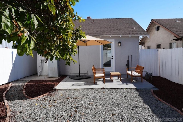 rear view of house with a patio