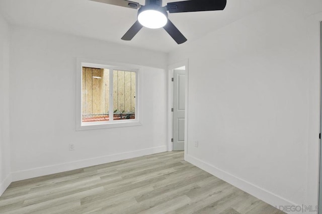 empty room featuring ceiling fan and light hardwood / wood-style flooring