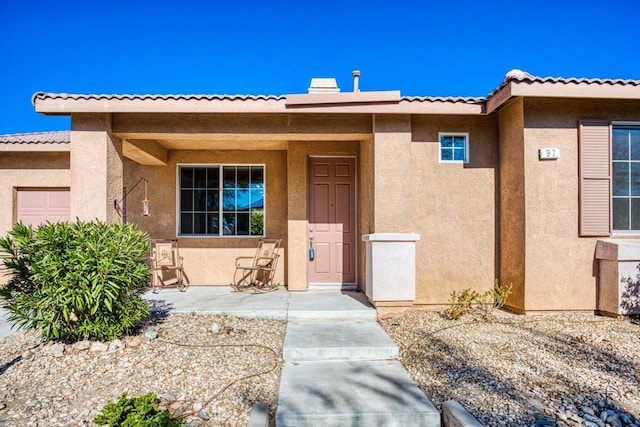 entrance to property featuring a garage