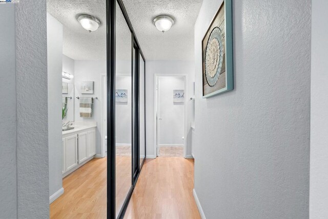 hall with light wood-type flooring