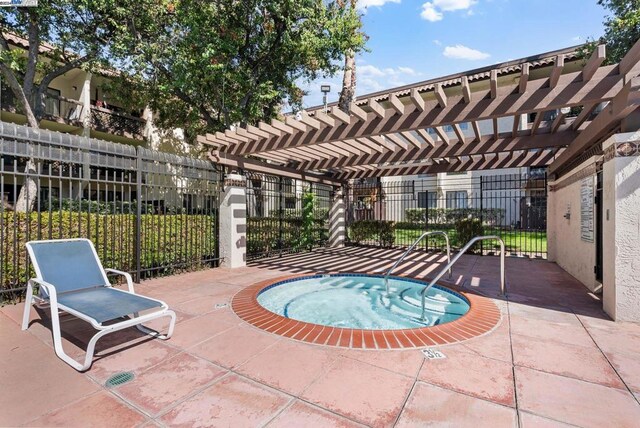 view of pool featuring a community hot tub, a patio, and a pergola