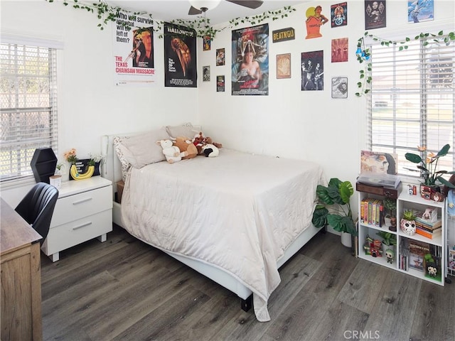 bedroom featuring ceiling fan and dark wood-type flooring