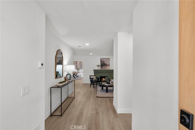 corridor featuring light hardwood / wood-style floors