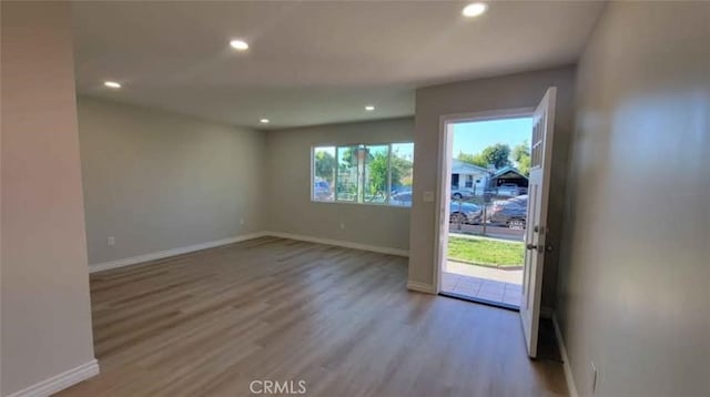 spare room with light wood-type flooring