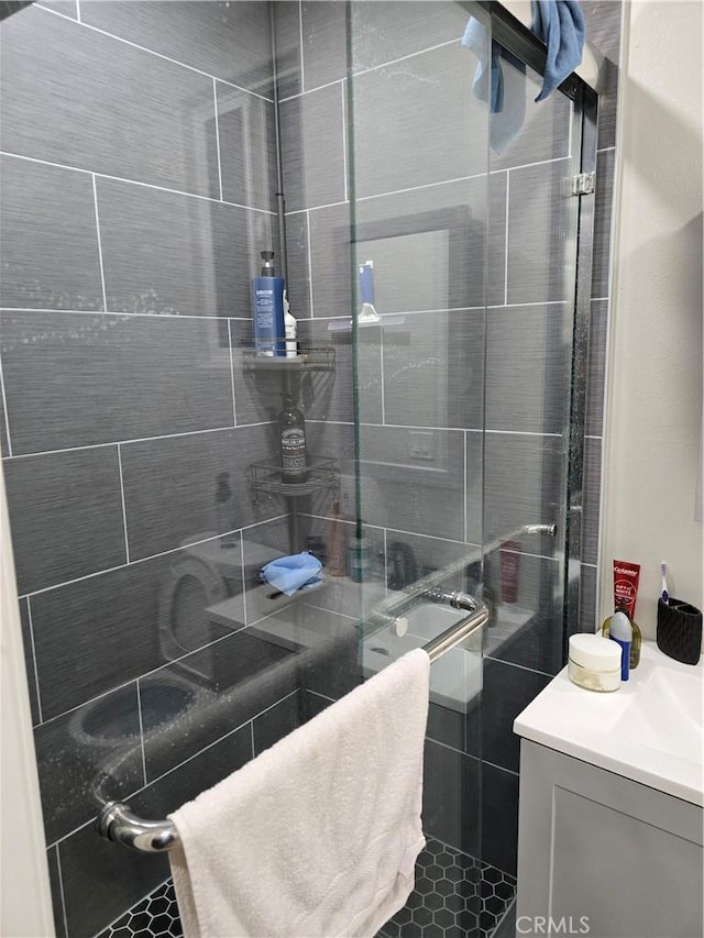 bathroom with vanity and walk in shower