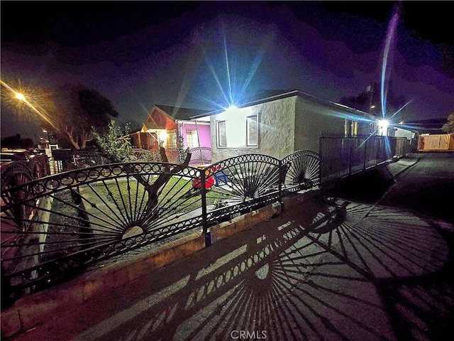 view of property exterior at night