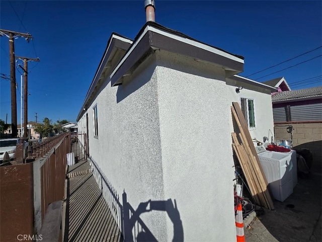 view of side of property featuring washer / dryer