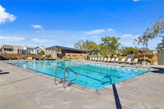 view of swimming pool with a patio area