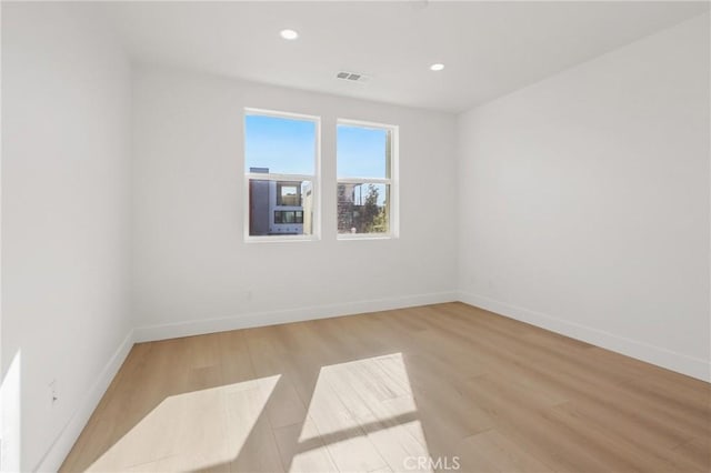 empty room with light wood-type flooring