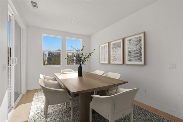 dining area with light hardwood / wood-style flooring