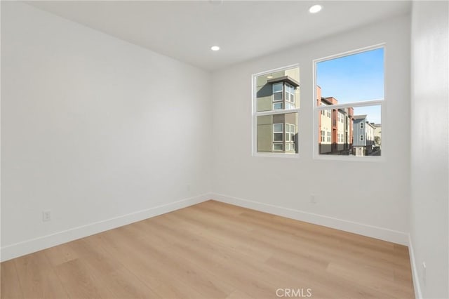 spare room with light wood-type flooring