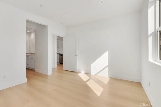 unfurnished room with light hardwood / wood-style flooring