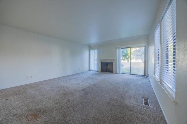 unfurnished living room with carpet floors