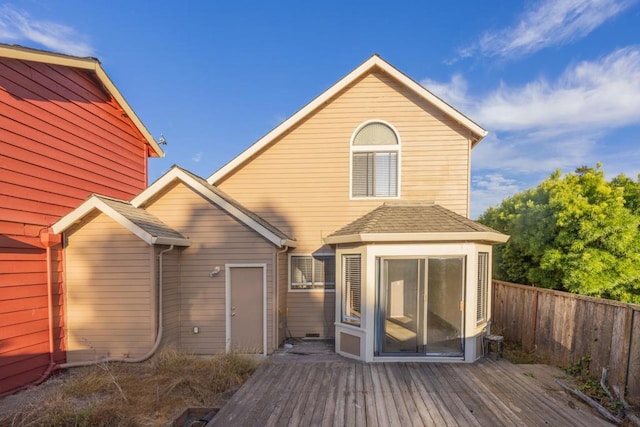 back of house featuring a wooden deck