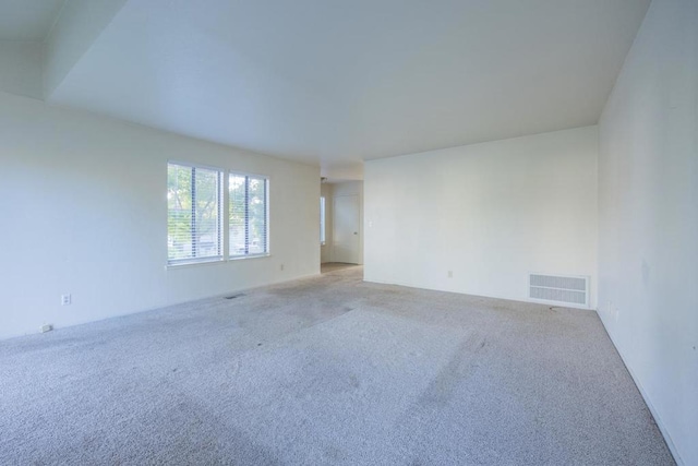 empty room featuring light carpet