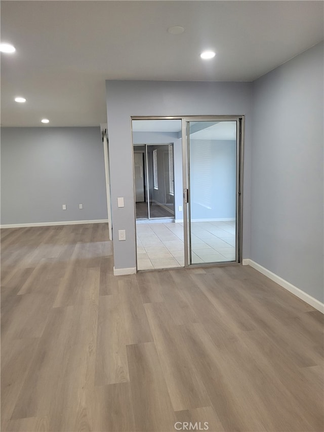 unfurnished bedroom with light hardwood / wood-style floors