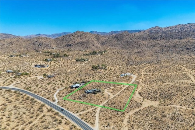 birds eye view of property with a mountain view, a rural view, and view of desert