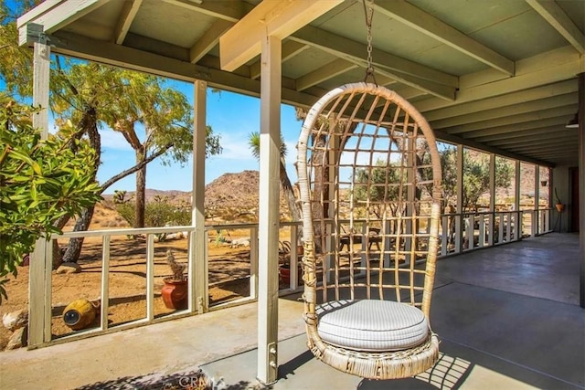 unfurnished sunroom with a mountain view