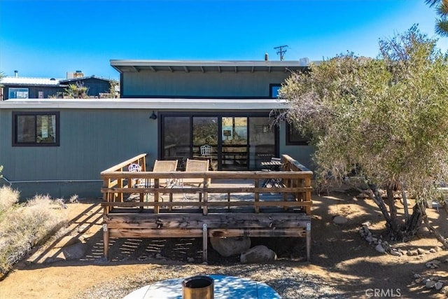 rear view of house with a deck