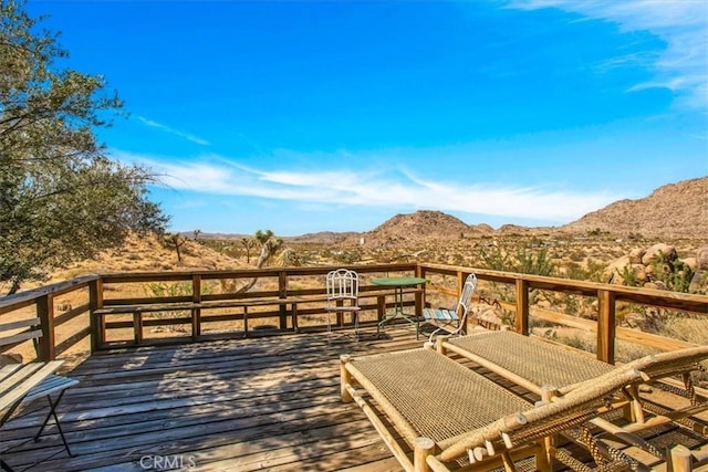 wooden terrace with a mountain view