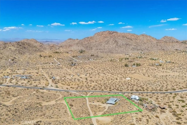 view of mountain feature featuring a rural view and view of desert