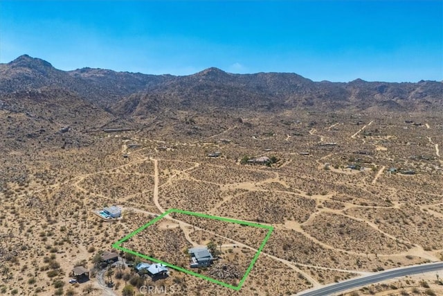 aerial view featuring a mountain view, a rural view, and view of desert