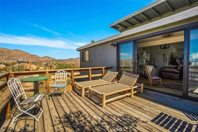 wooden deck featuring a mountain view