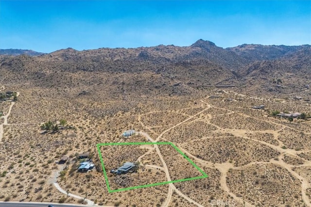 bird's eye view with view of desert and a mountain view