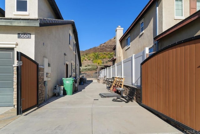 view of side of home featuring a mountain view