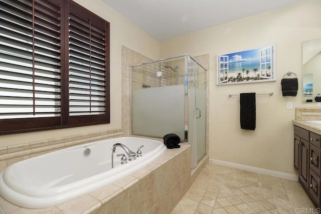 bathroom with tile patterned flooring, vanity, and plus walk in shower