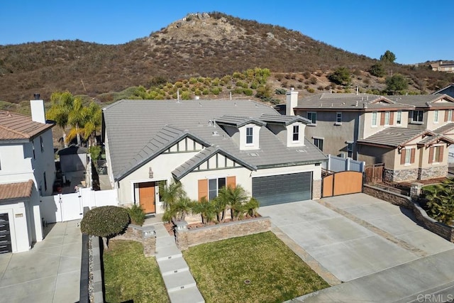 view of front of house with a mountain view and a garage