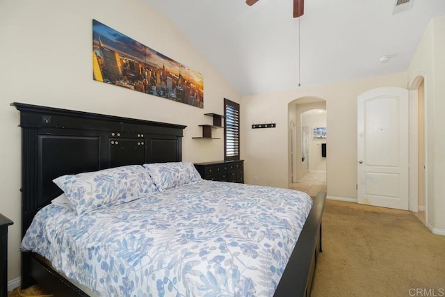 carpeted bedroom featuring vaulted ceiling and ceiling fan