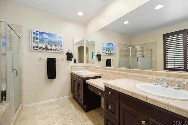 bathroom with vanity and an enclosed shower