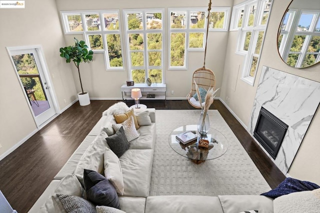 sunroom featuring a fireplace and a healthy amount of sunlight