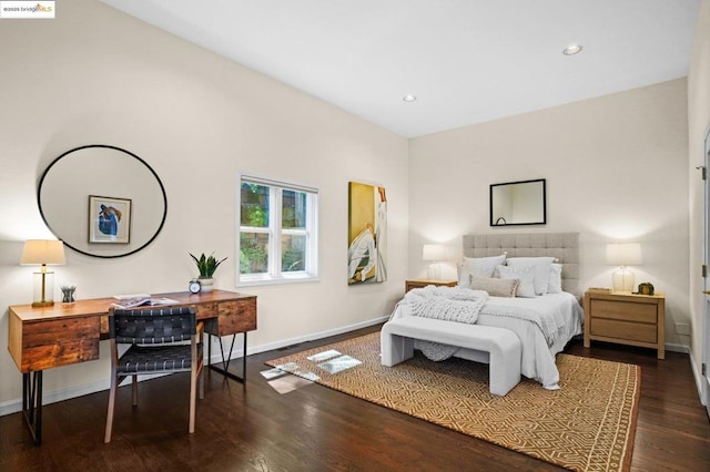 bedroom with dark hardwood / wood-style floors