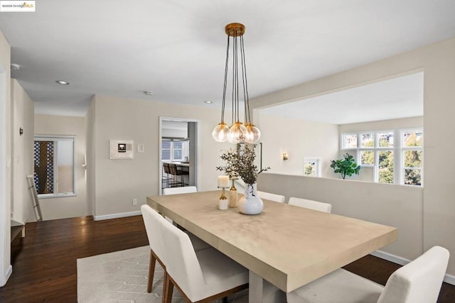 dining area featuring dark hardwood / wood-style floors