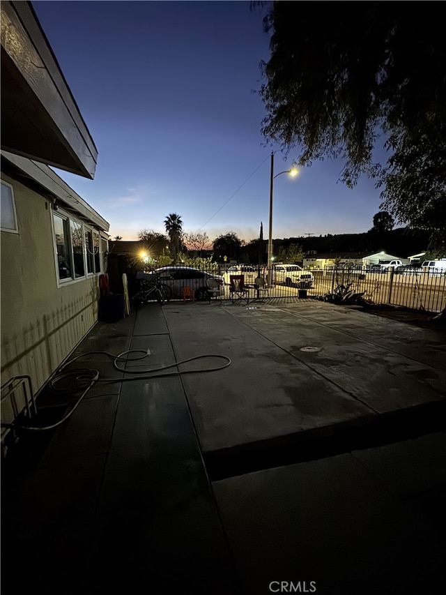 view of pool at dusk