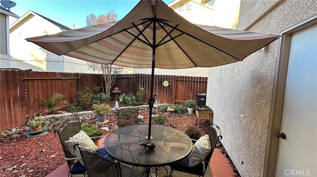 view of patio / terrace with outdoor dining area and a fenced backyard